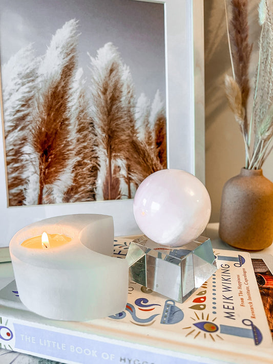 pink mangano calcite sphere on stand